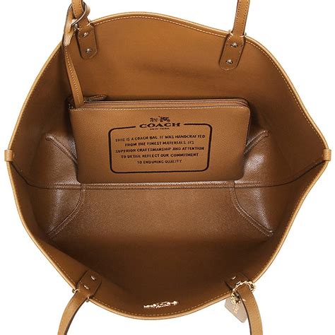 Spreesuki Coach Reversible City Tote In Signature Khaki Saddle