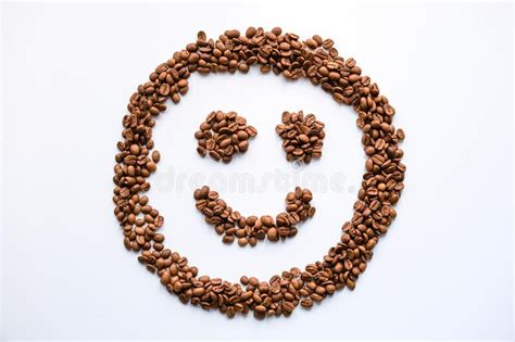Smiling Face Made Of Coffee Beans Isolated On A White Background Stock