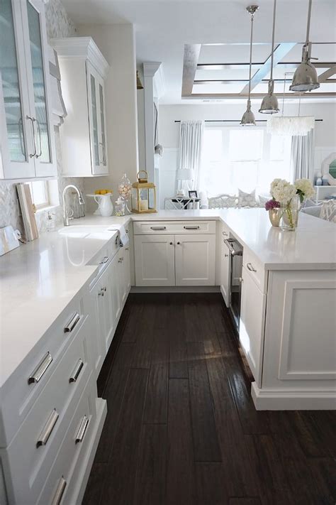 Gray quartz countertops with white cabinets also pair well together, and, similar to beige, grey provides a versatile and neutral backdrop for other elements. Kitchen Peninsula. White kitchen with peninsula. Perimeter ...