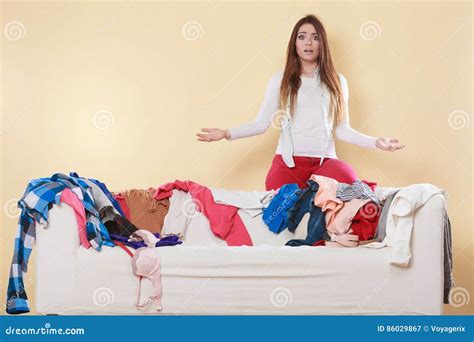 Helpless Woman Sitting On Sofa In Messy Room Home Royalty Free Stock
