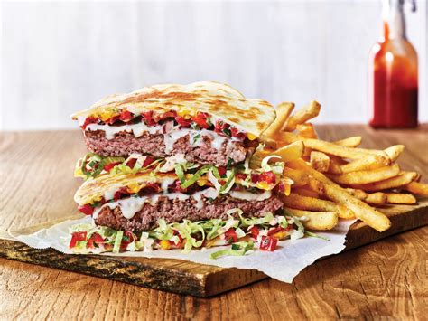 Applebees Is Serving Quesadilla Burgers And Fireball Infused Bacon
