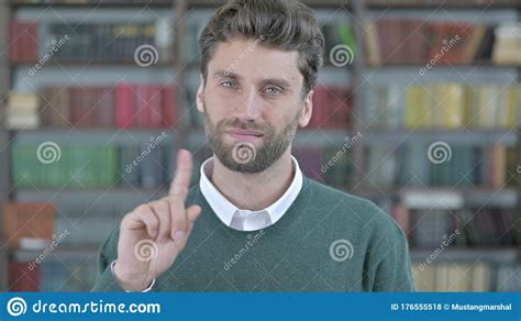 Upset Young Man Saying No With Finger Sign Stock Photo Image Of