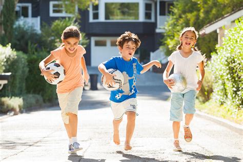 Malcolm Fearon Photography Three Kids Running Holding Soccer Footballs
