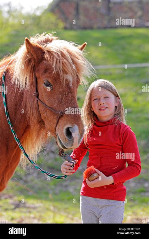 Young Girl With A Pony Stock Photo Alamy