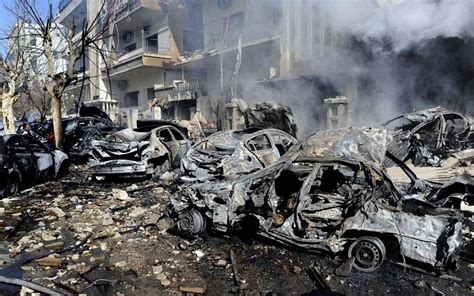 Regime Blames Rebels After Twin Bombings Kill Dozens In Damascus The