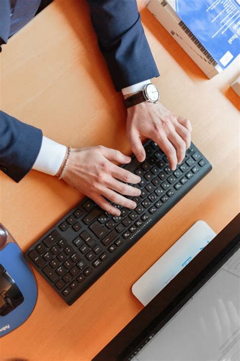 When typing, imagine the location of the symbol on the keyboard. Man Typing on Computer Keyboard · Free Stock Photo