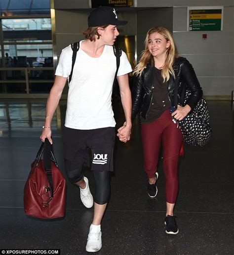 Brooklyn Beckham And Chloe Grace Moretz Hold Hands As They Catch Flight