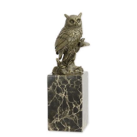 A Bronze Sculpture Of A Long Eared Owl
