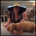 Carly at home wearing a hat and pearls with her dog, Aja. | Carly simon ...