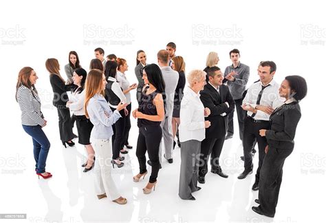 Group Of Business People Standing And Talking To Each Other Stock Photo