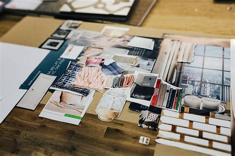 Royalty Free Photo Designers Working With Material Samples And Paper