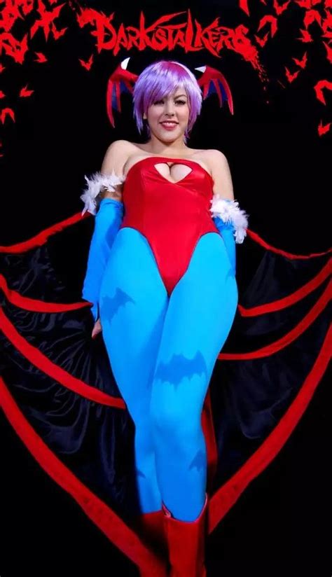 A Woman In A Red And Blue Costume Posing For The Camera With Her Hands On Her Hips