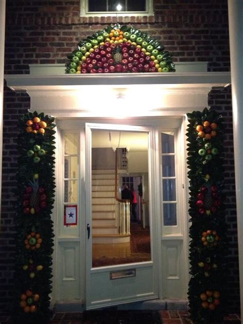 An Entrance To A House Decorated With Fruit