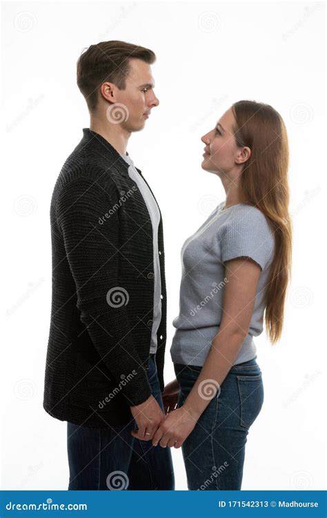 The Guy And The Girl Are Standing In Front Of Each Other And Have Taken