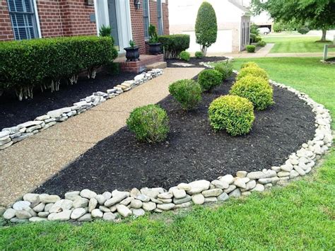Red House Landscape With White Rock River Rock Landscaping Ideas