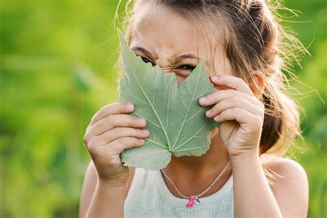 A Vibrant Girl Peeking Through A Green Leaf By Alison Winterroth Leaf