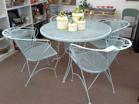 Dual pedestal picnic table with attached shade canopy. SOLD - This is a vintage expanded metal patio set. It has a round table that measures 42 inches ...