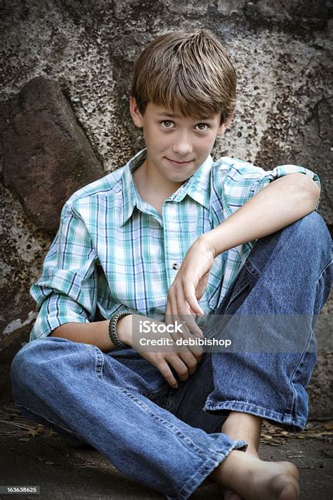 Barefoot Boy Sitting Closeup Wearing Blue Jeans Plaid Shirt Stock Photo