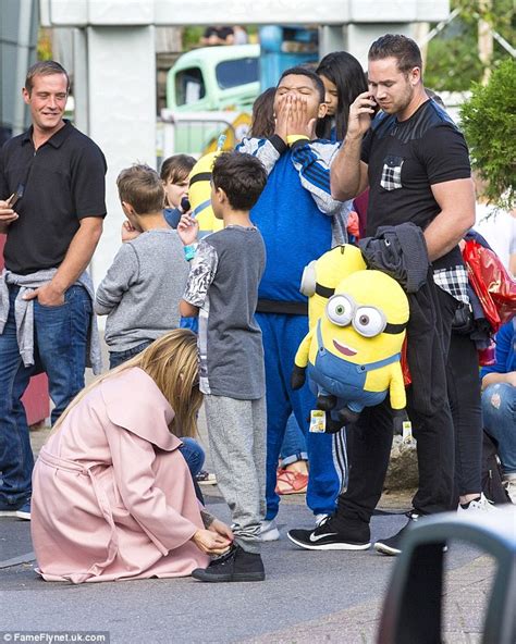 Katie Price Enjoys Day At A Theme Park With Sons Harvey