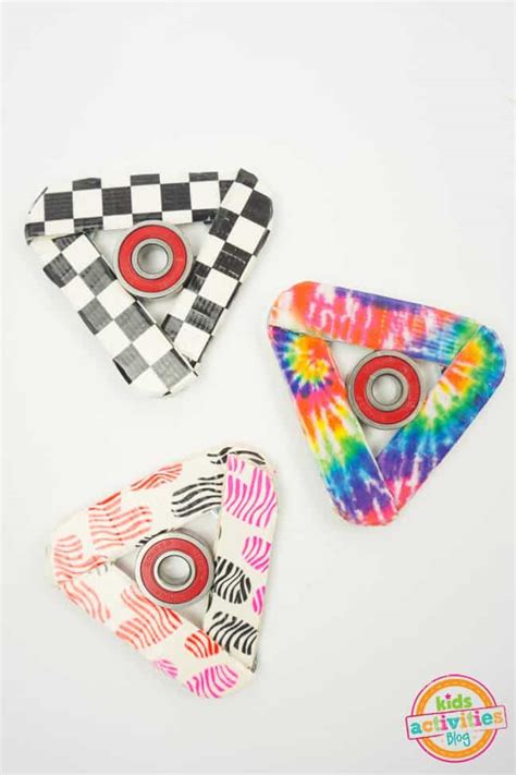 Just glue two 5/8 jean buttons onto each side and that's it! 11 DIY Fidget Spinners for the Trendiest Kids