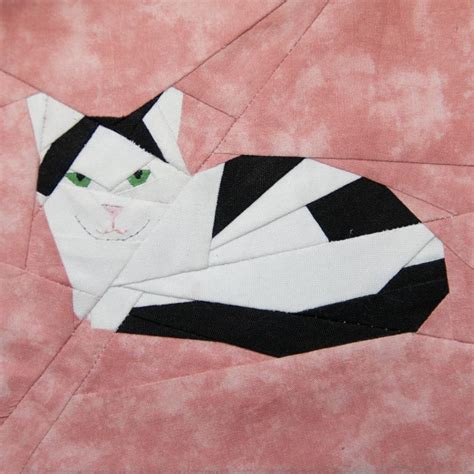 Any cat lover would love to curl up under a cat quilt block comforter. Spotted Cat paper-piecing by schenley - Craftsy