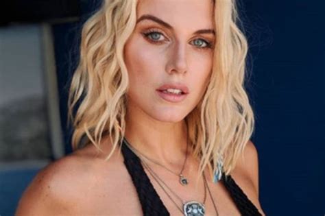 Ashley James Teeters On Wardrobe Malfunction In Plunging Cut Out