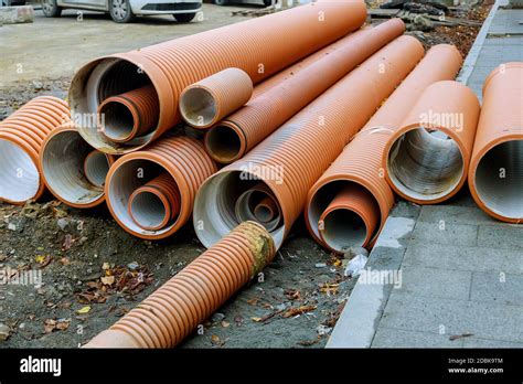 Pvc Tubes Plastic Pipes Stacked In Rows At A Construction Site On