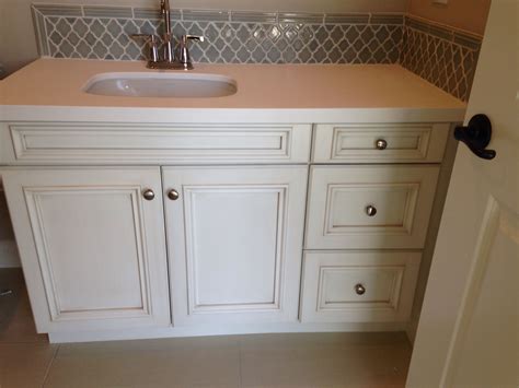 White is always a top option in the kitchen that homeowners can fall back to when they don't have any other ideas. Secondary bath with antique white glazed cabinets and Walker Zanger Vibe mosaic and rail molding ...