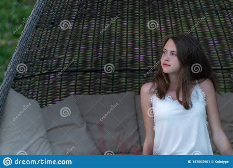 Pretty Young Woman Relaxing In A Wicker Chair Stock Image Image Of Long Lifestyle 147602901