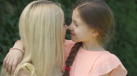 Portrait Of Mom Kissing Her Little Daughter Stock Video Envato Elements