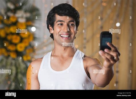 Man Taking A Picture Of Himself With A Mobile Phone And Smiling Stock