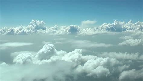 Flying Through White Clouds At Daytime Seamless Loop Extreme High