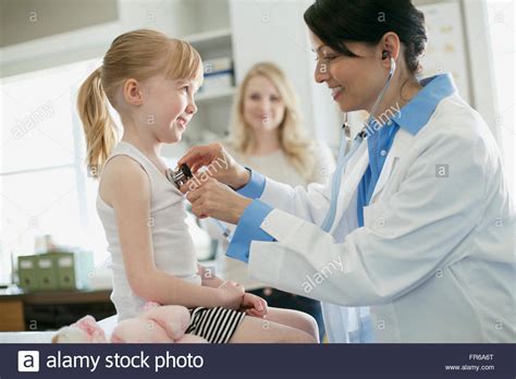 Mother And Daughter At Doctors Office Stock Photo Alamy
