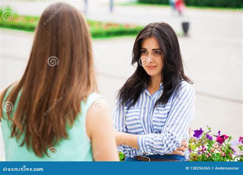 Two Young Women Talking To Each Other Stock Image Image Of Happy