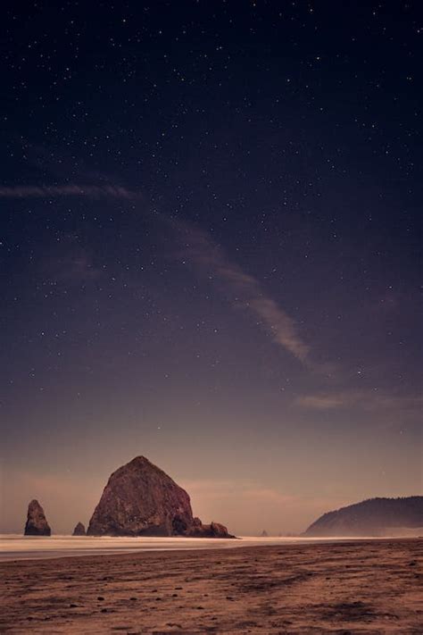 Brown Rock Formation Under Starry Sky · Free Stock Photo
