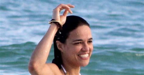 Michelle Rodriguez Flashes Armpit Hair And Toned Bikini Bod While