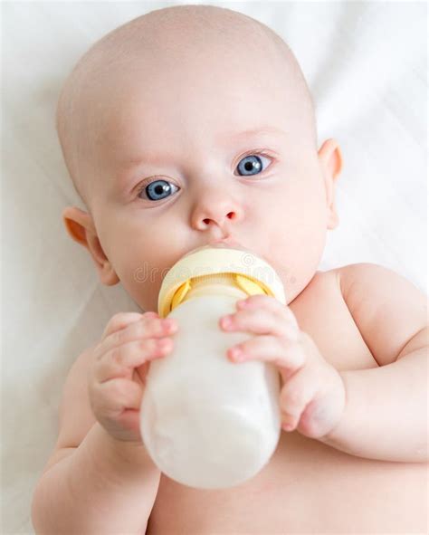 Adorable Child Drinking From Bottle Stock Image Image Of Lying