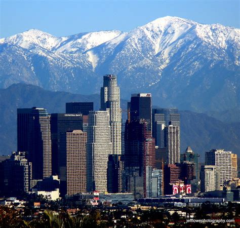 Los Angeles Skyline Snow Capped Mountains A Photo On