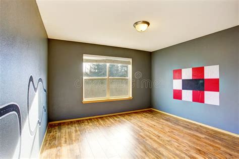 Empty Kids Room Interior With Grey Walls And Hardwood Floor Stock