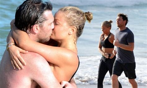 Lara Bingle And Sam Worthington Embrace And Kiss In The Sea After A