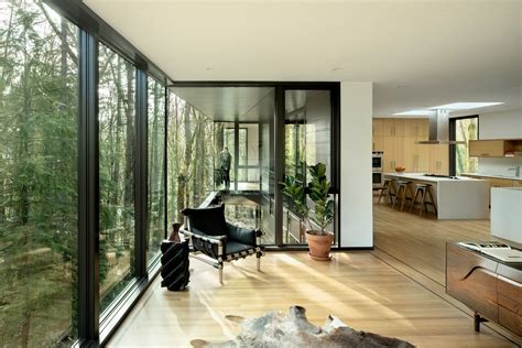 Black Wood And Glass Volumes Stagger Down Oregon Woodland To Form Royal