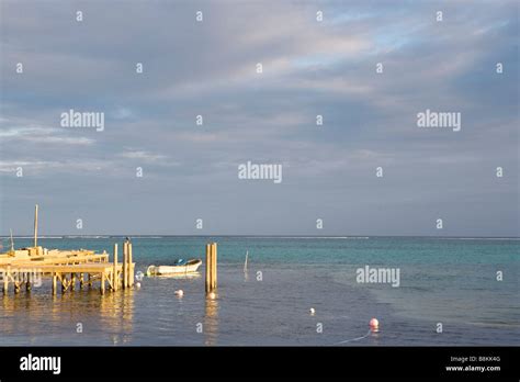 Sunset Small Boat And Pier On Ambergris Caye In Belize Stock Photo Alamy