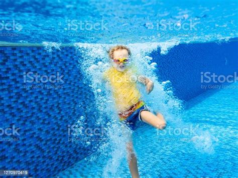 Child Underwater In Swimming Pool Kids Swim Stock Photo Download
