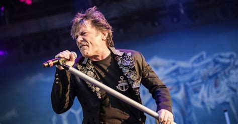 iron maiden singer bruce dickinson alludes to oral sex as cause of his tongue cancer