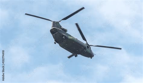 Double Rotor Heavy Airlift Military Helicopter In Flight With Rear