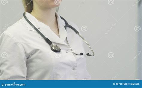 Female Doctor Putting On Stethoscope Stock Photo Image Of Happy