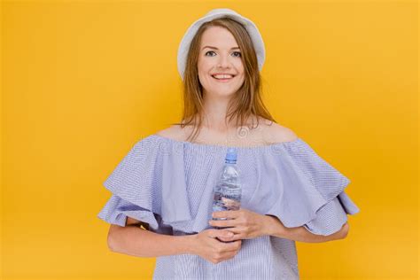 Attractive Female In Stylish Top With Bare Shoulders Holding Bottle Of Fresh Water In Hand Hot