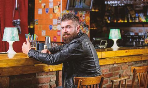 Brutal Hipster Bearded Man Sit At Bar Counter Drink Beer Friday