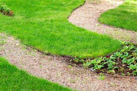 Pebbled Path In The Garden With A Flower Bed Stock Photo Image Of