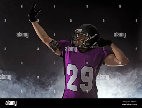American Football Player On Smoky Background Stock Photo Alamy